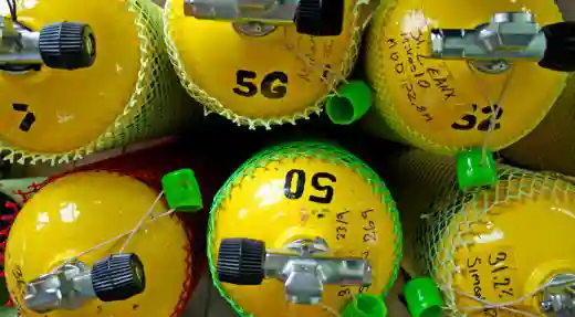 Close-up of yellow scuba tanks prepared for enriched air nitrox diving in Koh Tao, Thailand