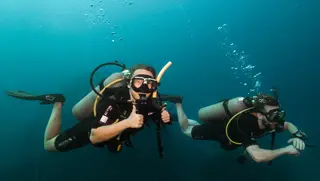 Diver exploring a deep wall during the SSI Deep Diving Specialty course at Echo Divers Koh Tao.