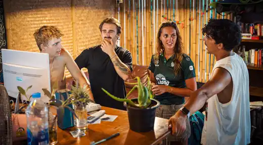 Echo Divers Koh Tao Echo Hostel guests chatting at reception in a relaxed social common area, Koh Tao, Thailand