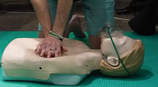 Echo Divers Koh Tao SSI React Right student practising CPR on a mannequin during first aid training, Koh Tao, Thailand