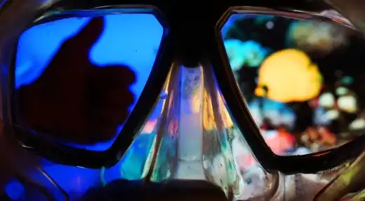Echo Divers Koh Tao Echo Hostel guest relaxing on a rooftop chill area with sunset sea view, Koh Tao, Thailand