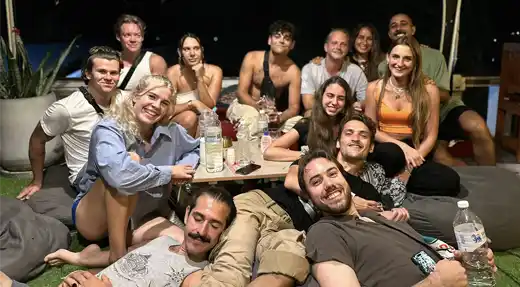 Echo Divers Koh Tao Echo Hostel guests chatting at reception in a relaxed social common area, Koh Tao, Thailand