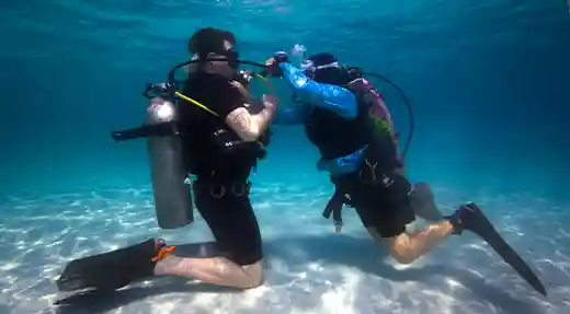 Echo Divers Koh Tao student practicing in shallow water during SSI Open Water confined water training in Koh Tao, Thailand
